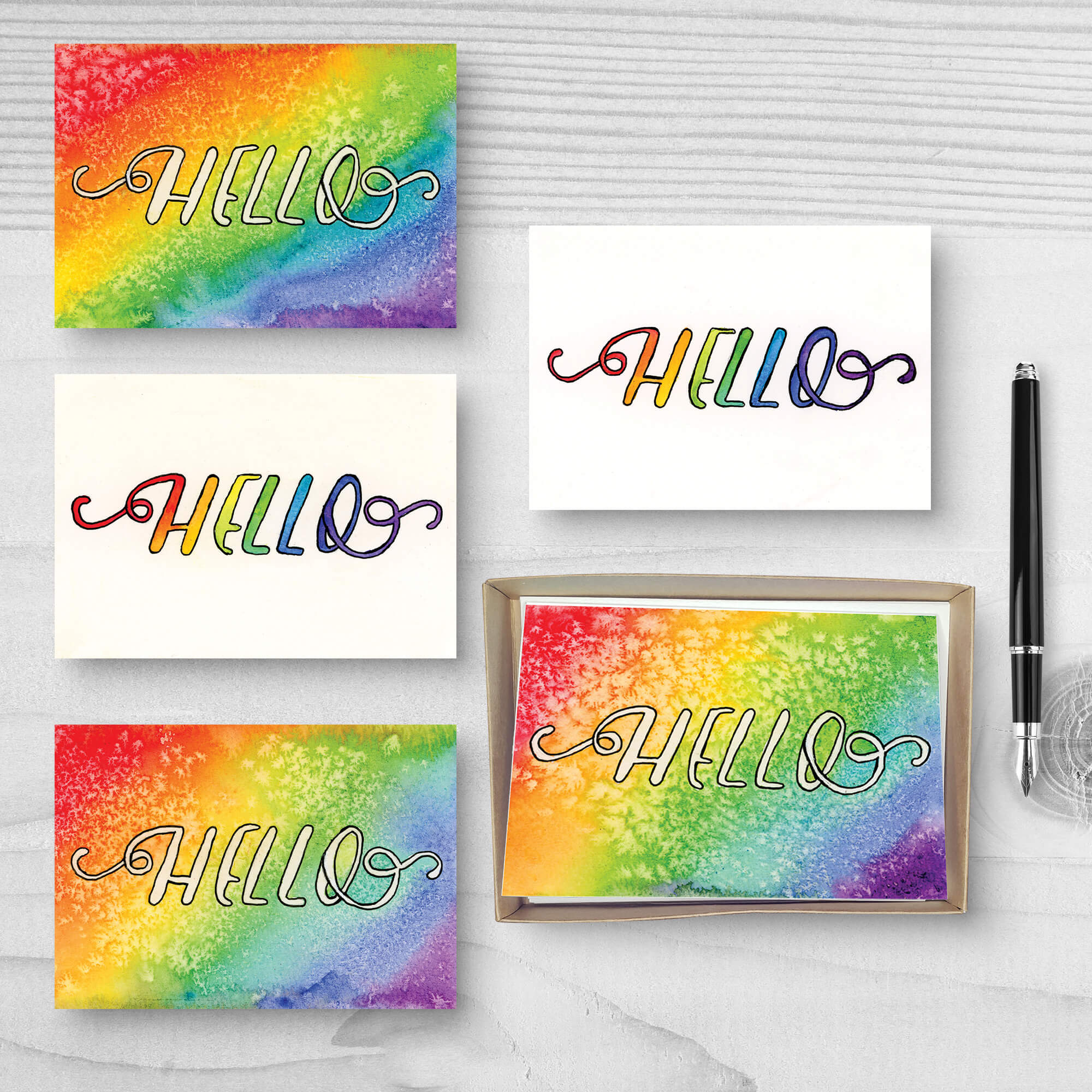 Set of five "Hello" greeting cards with a variety of rainbow backgrounds and salt textures