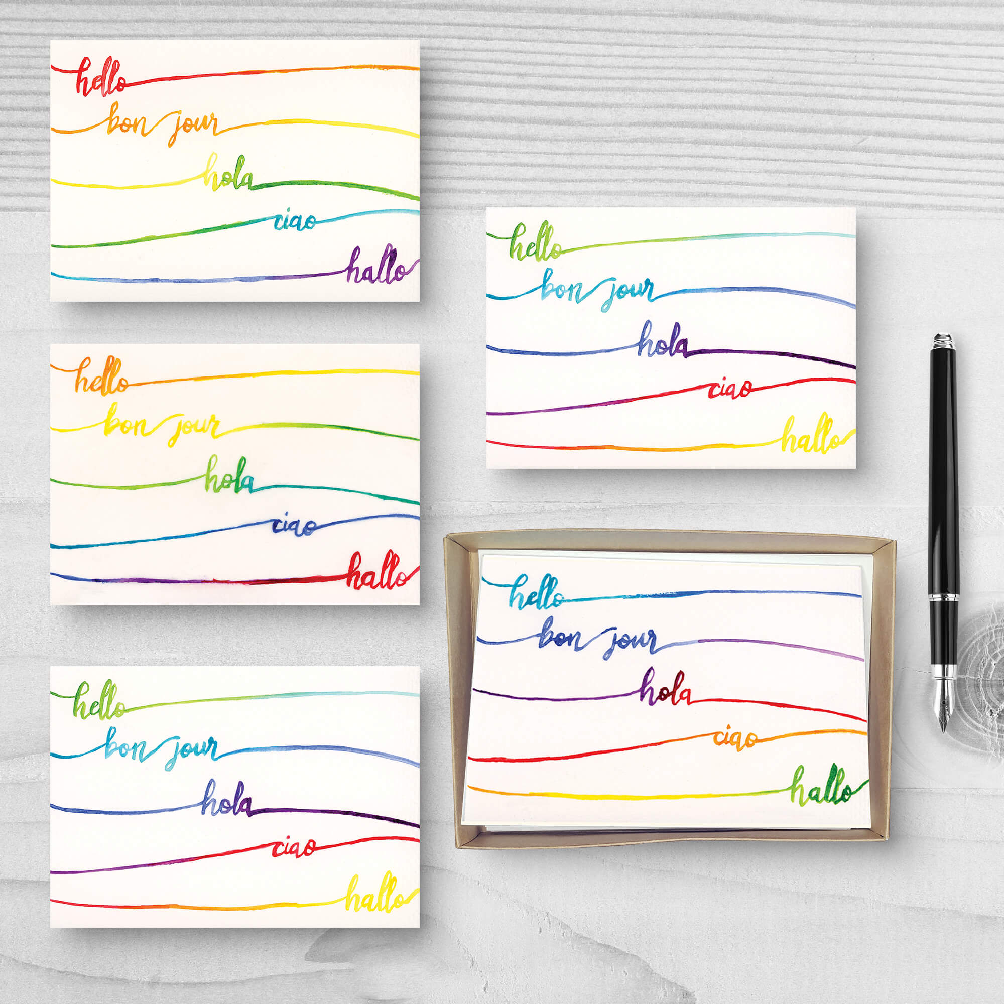 Set of five "Hello" greeting cards with the phrase "hello" in five languages and different rainbow gradients on each card