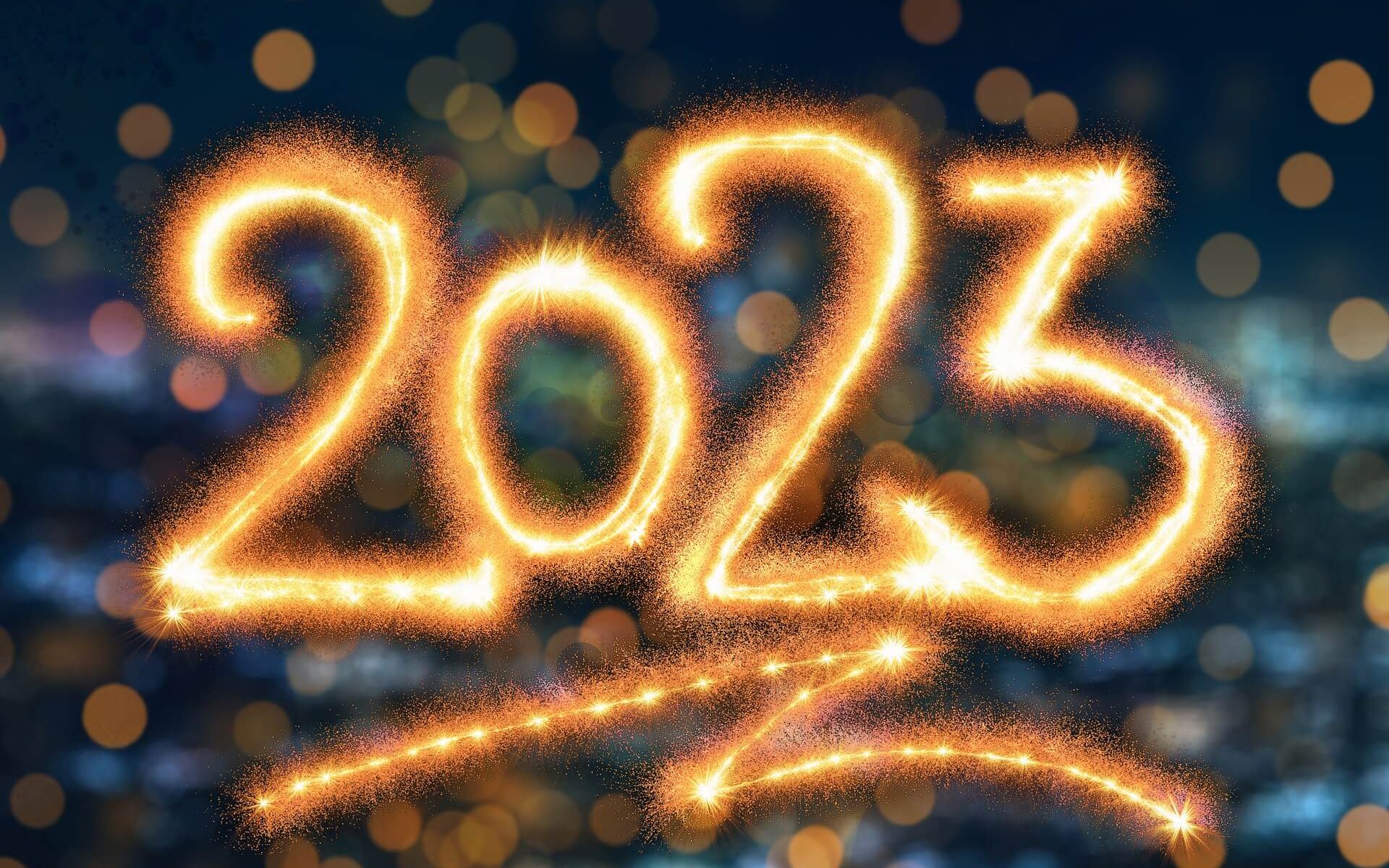 New Year, New Me Blog Post Header - Sparkler Writing 2023 with bokeh background