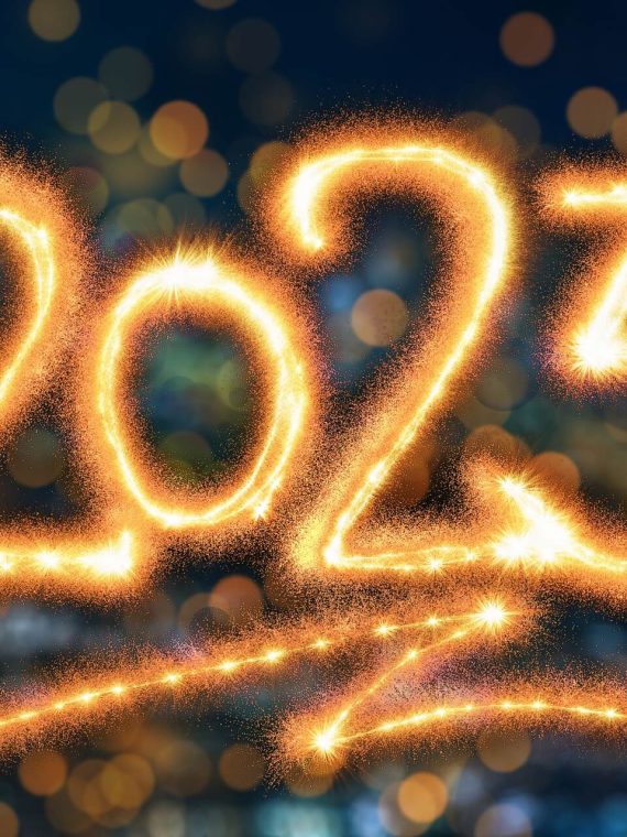 New Year, New Me Blog Post Header - Sparkler Writing 2023 with bokeh background